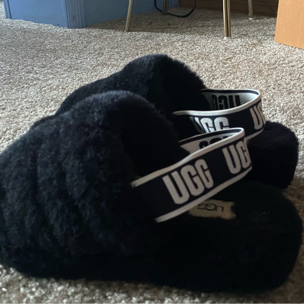 Size eight in womens ugg slides.